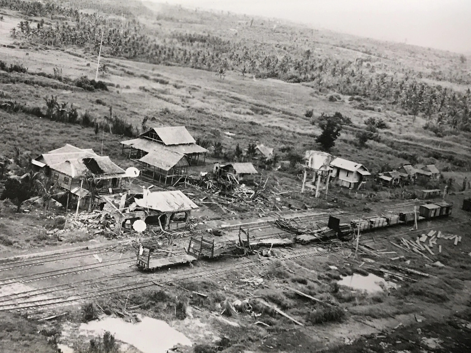 Close Aerial View of Destroyed Village and Damaged Rail Siding, Pacific Theater