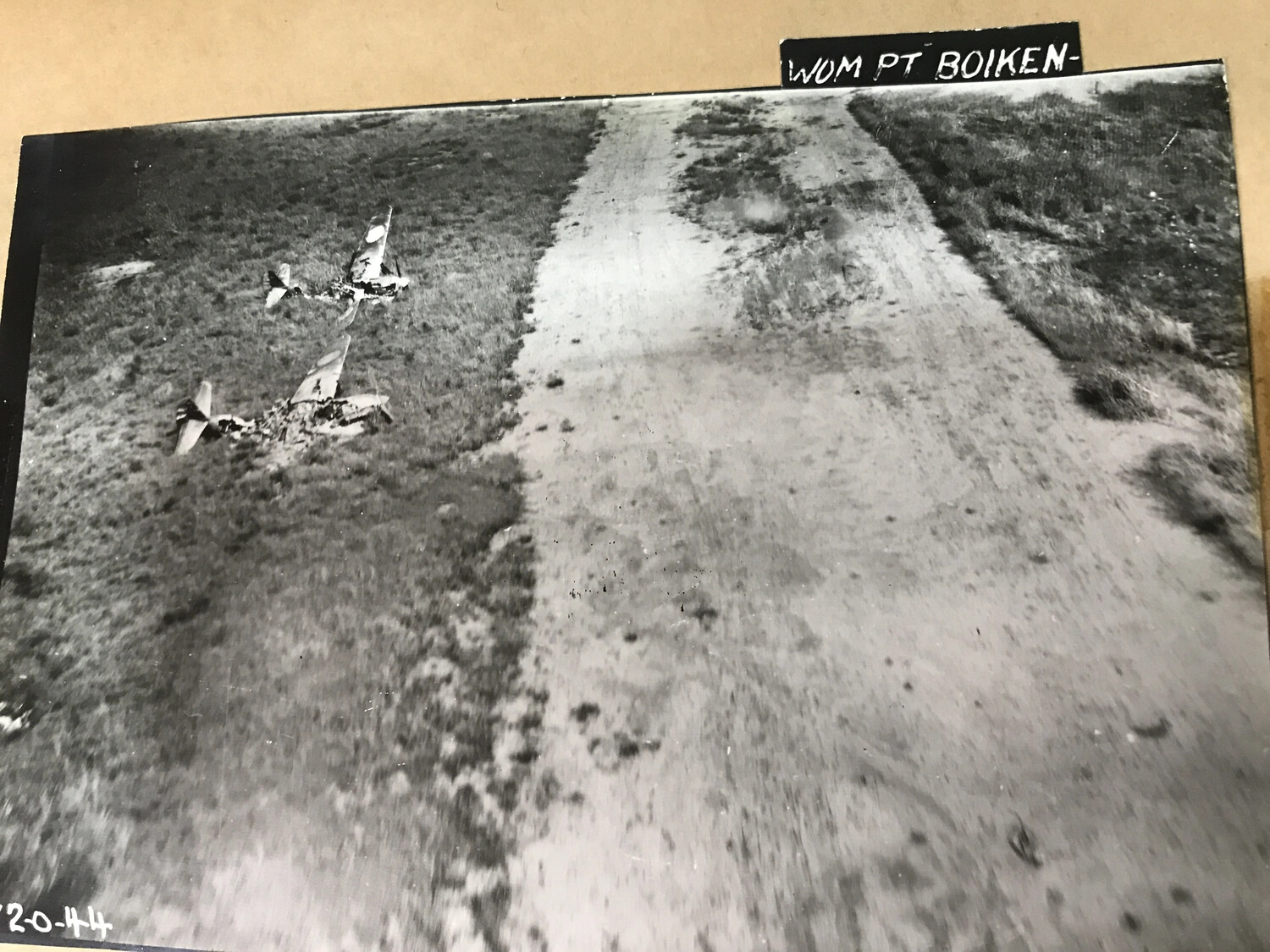 Wrecked Aircraft at Wom Point, Boiken, New Guinea — 312th Bomb Group Album, 1944