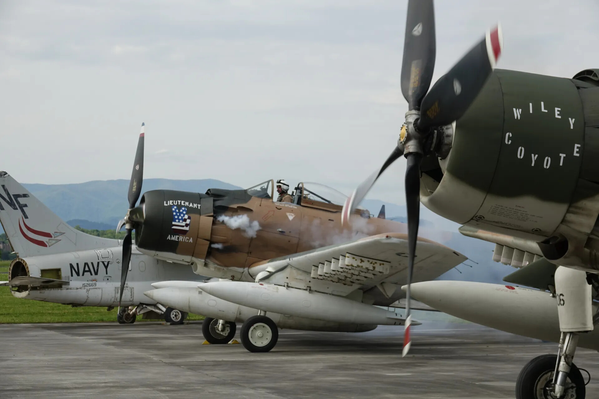 Restored A-1 Skyraiders 'Wiley Coyote' and 'Lieutenant America' with U.S. Navy A-7 Corsair II on Static Ramp, May 2019 Airshow Event