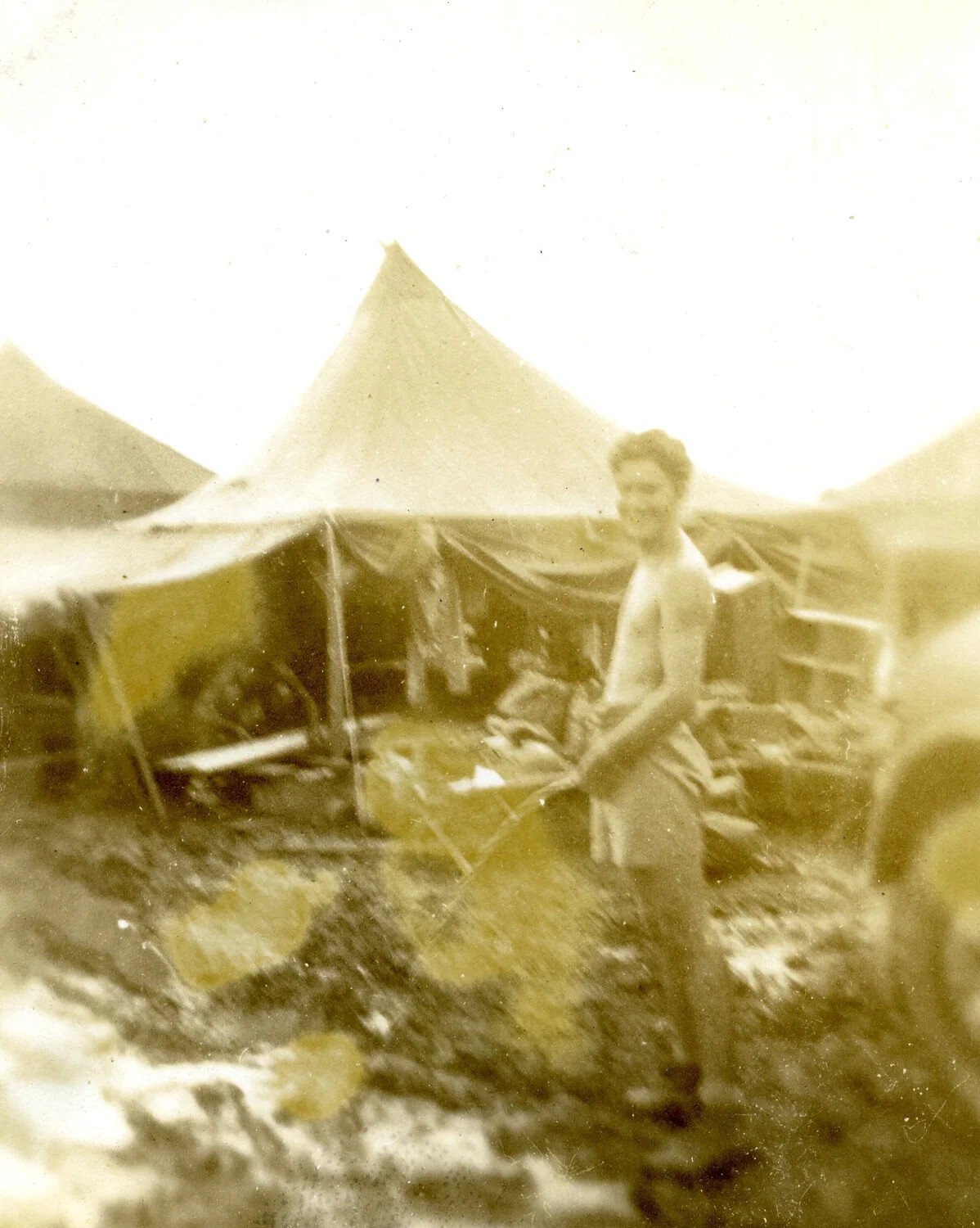 Serviceman at Camp Worktable, 345th Bomb Group Encampment, Ie Shima, WWII (Water-Damaged Print)