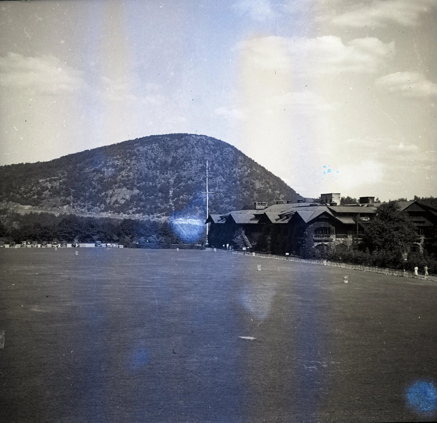 Rustic Lodge and Athletic Field Beneath a Hudson Highlands Mountain