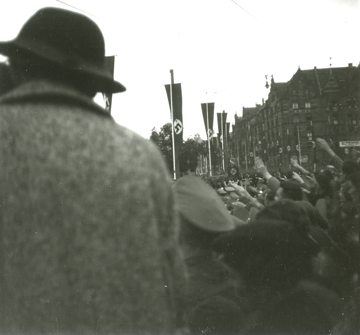 Crowd with Raised Salutes Along Swastika-Lined Street, Nuremberg, Germany, 1930s