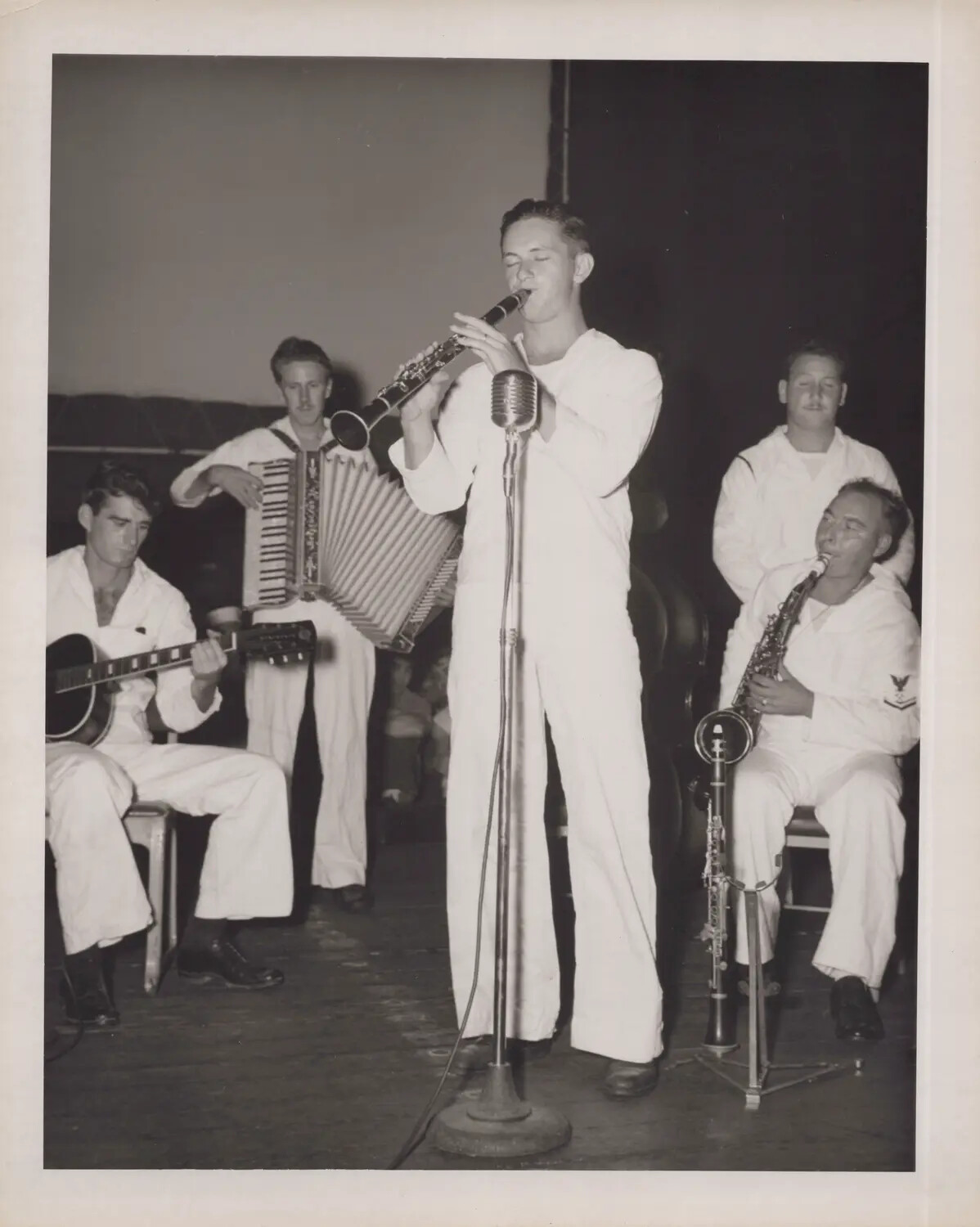 Shipboard Band Performance with Clarinet, Accordion, Guitar, and Saxophone Aboard a U.S. Navy Escort Carrier, WWII