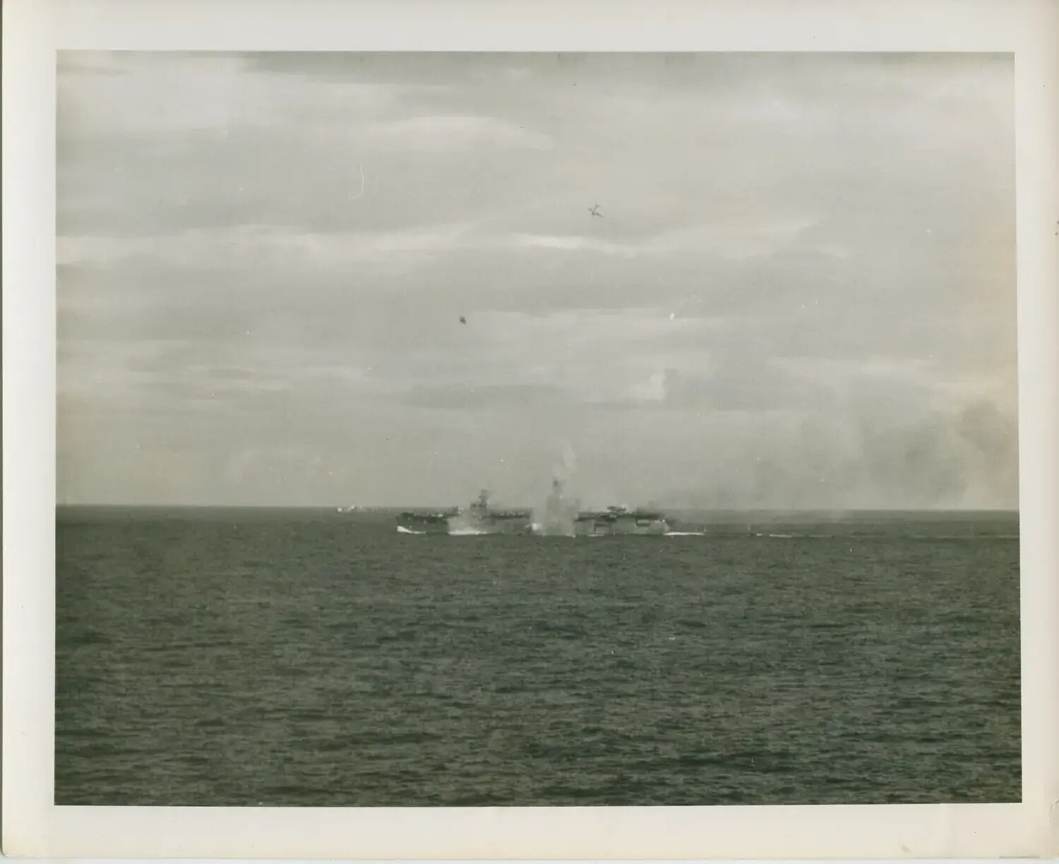 Escort Carriers Underway at Sea with Rising Smoke, USS Petrof Bay (CVE-80) Collection