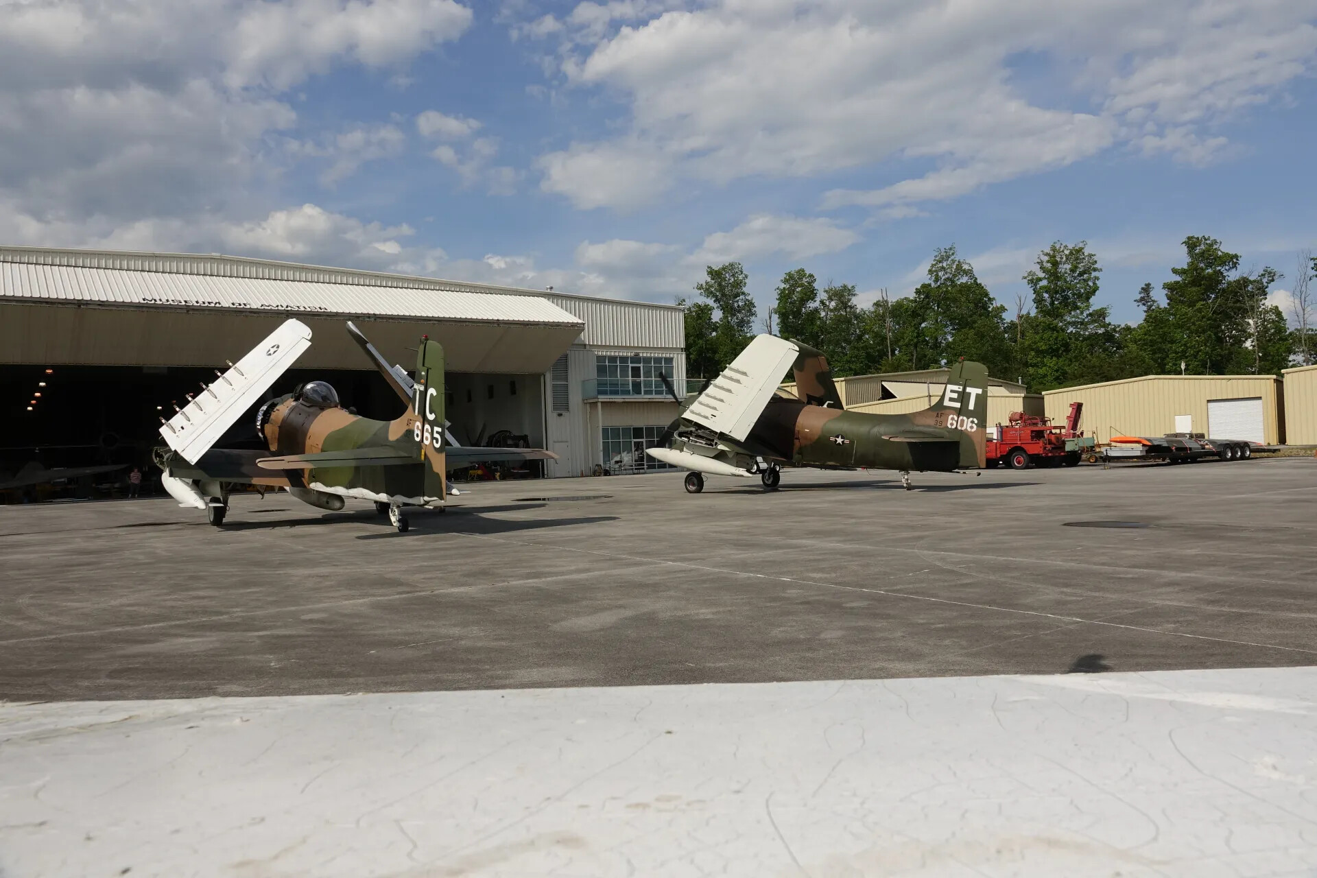Two A-1 Skyraiders (Tail Codes TC-665 and ET-606) on Ramp at Museum of Aviation