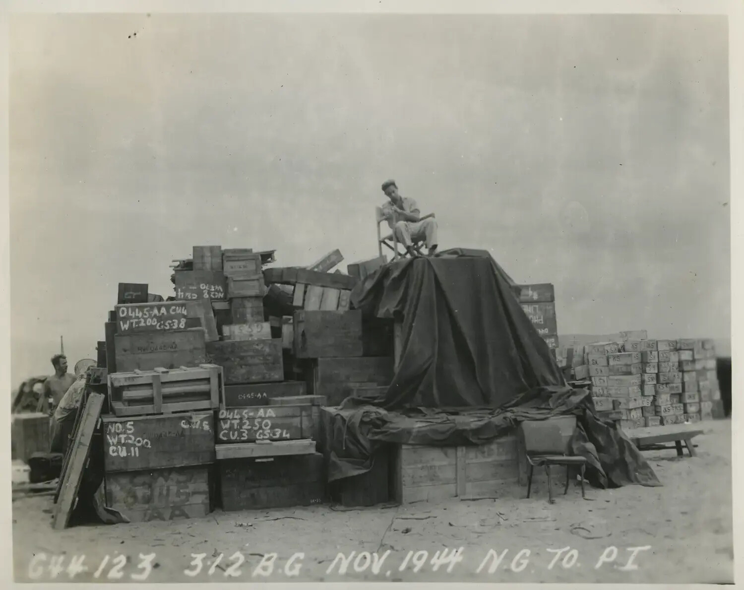 Supply Crate Stockpile with Serviceman, 312th Bombardment Group Staging Area, November 1944