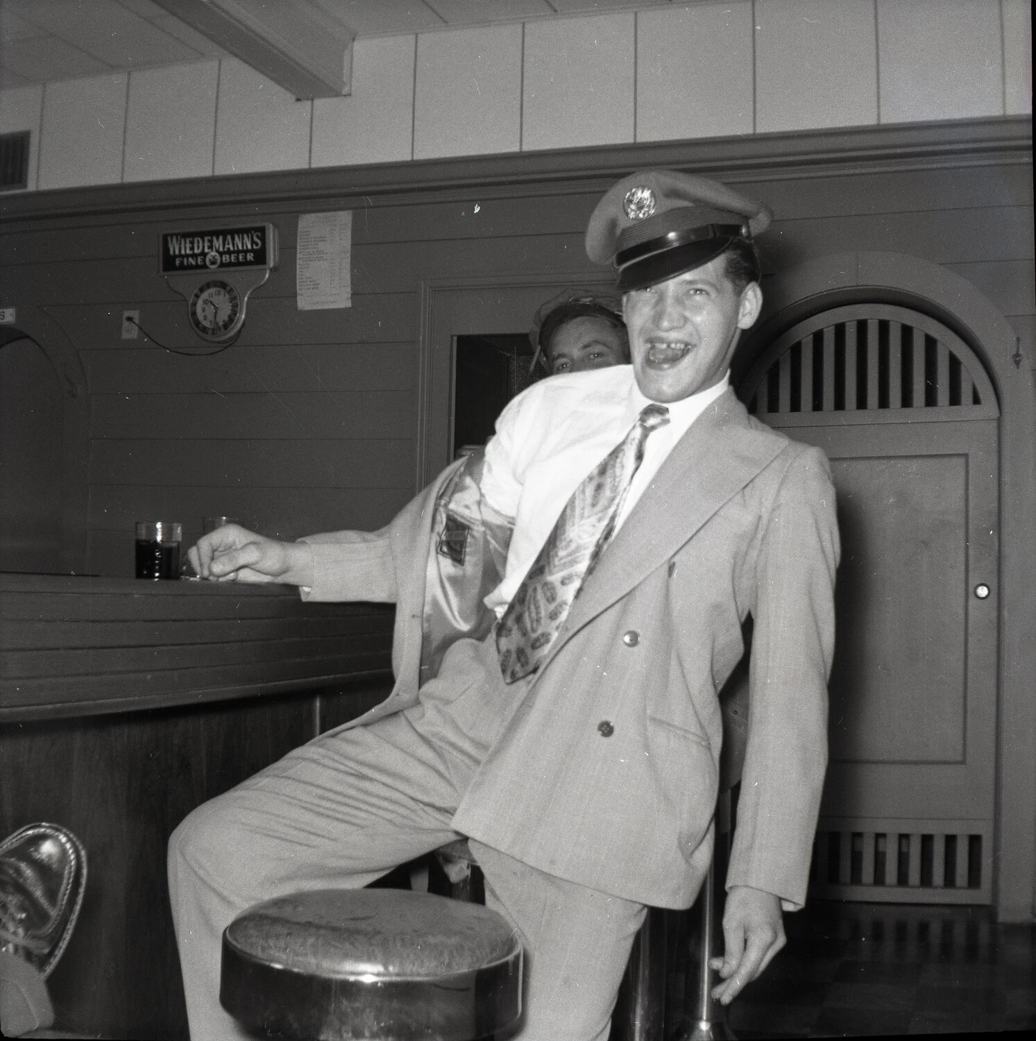 Laughing Man in Suit and Cap at the Bar, Wiedemann's Beer Sign Visible, Early 1950s