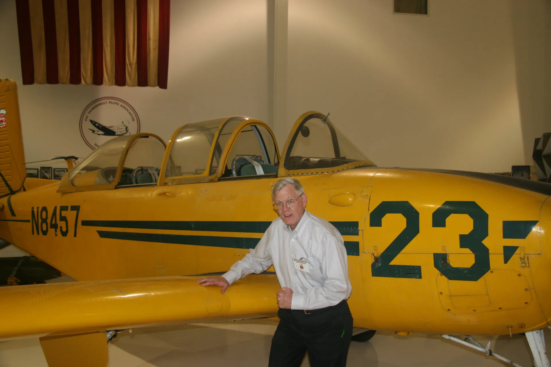 Veteran Beside Restored Yellow Primary Trainer N8457 at an Aviation Museum, Operation Tailwind Gathering, 30 April 2016