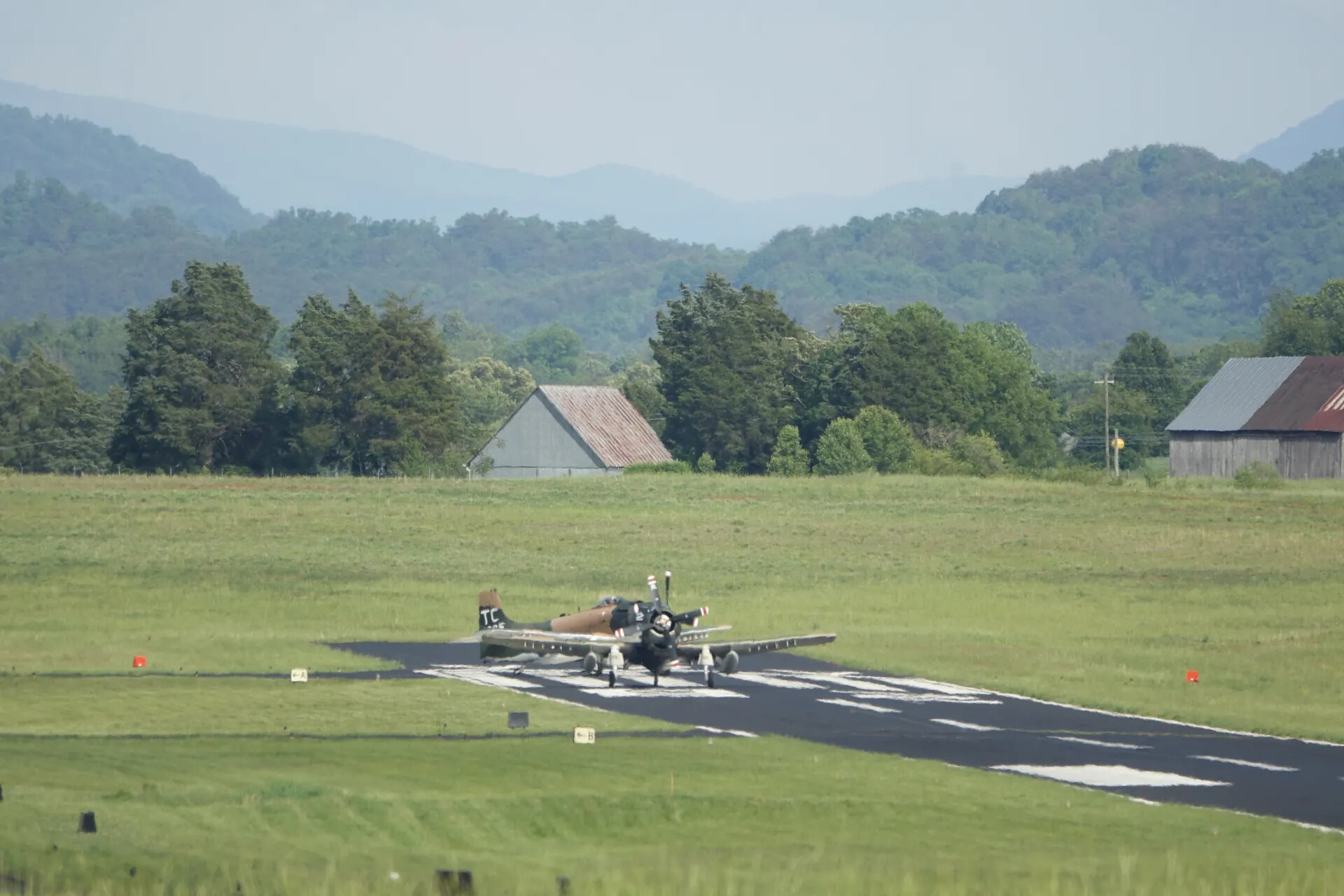 Douglas A-1 Skyraider Taxiing at Rural Airfield, Tennessee Air Show Event