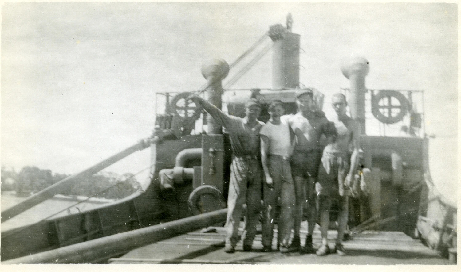 Servicemen Posing on the Foredeck of a U.S. Army/Navy Cargo Vessel, Pacific Theater, World War II