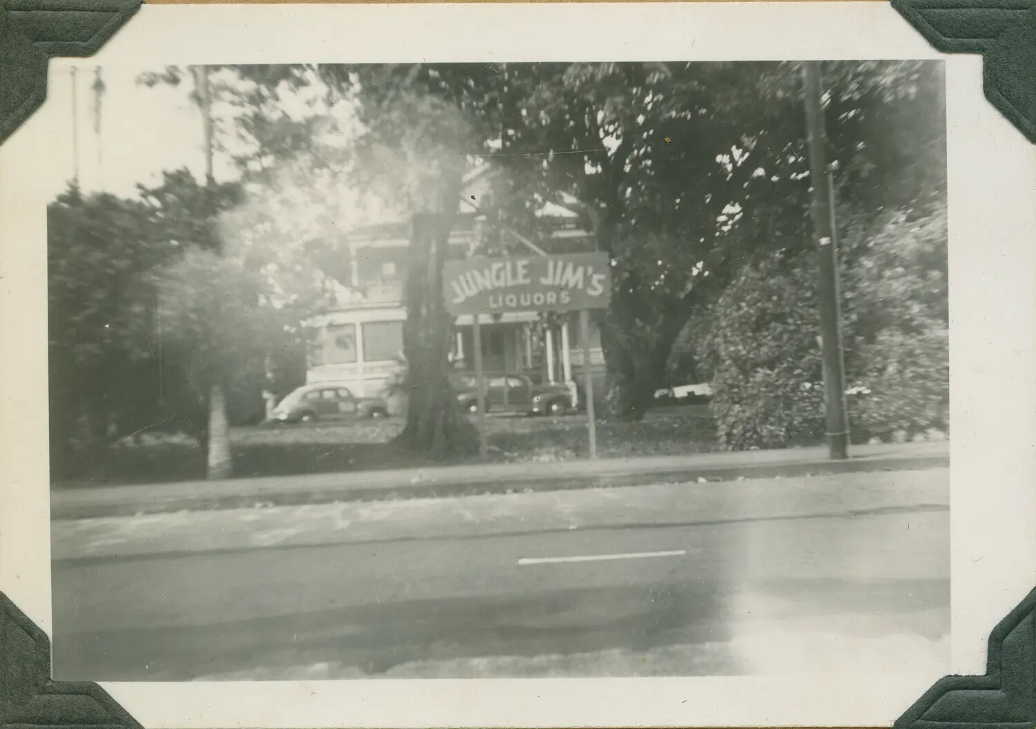 "Jungle Jim's Liquors" Storefront and Roadside Scene, Hawaii, World War II Era