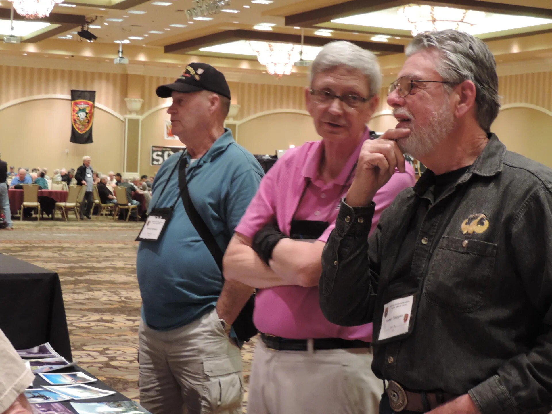 Robert Shippen and Two Attendees Viewing a Photograph Display, SOAR XXXVII, Las Vegas, 2013