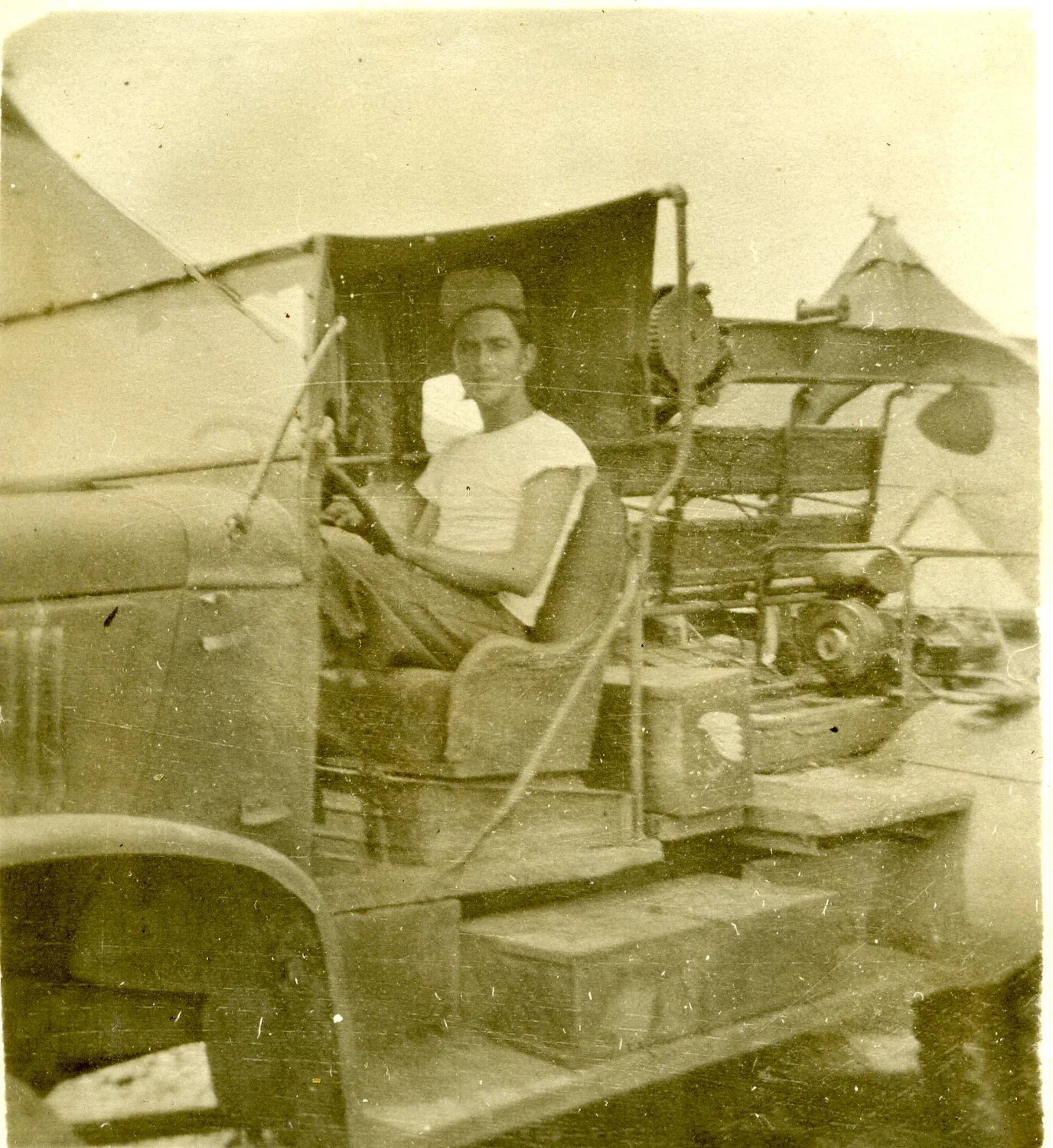 US Airman Seated at Truck/Trailer Controls, Forward Pacific Airfield, 1945