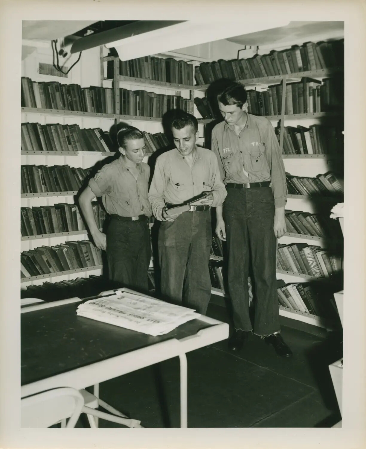 Sailors Browsing the Ship's Library Aboard USS Petrof Bay (CVE-80), World War II