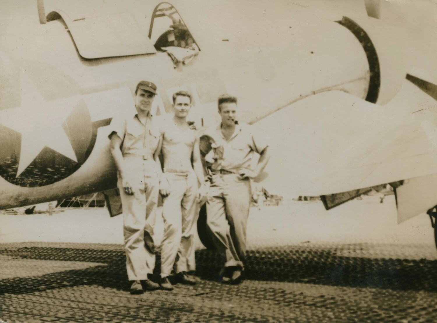Three Naval Aviation Personnel Posed Beside a Carrier-Type Fighter Aircraft, WWII Pacific Theater