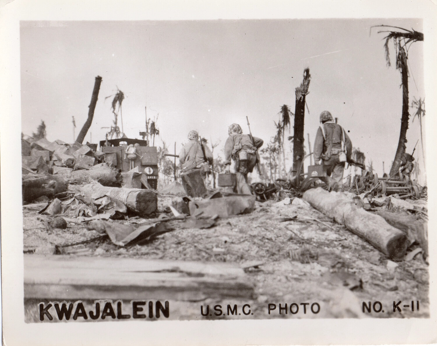 U.S. Marines Advance Through Bombardment Wreckage, Kwajalein Atoll, 1944