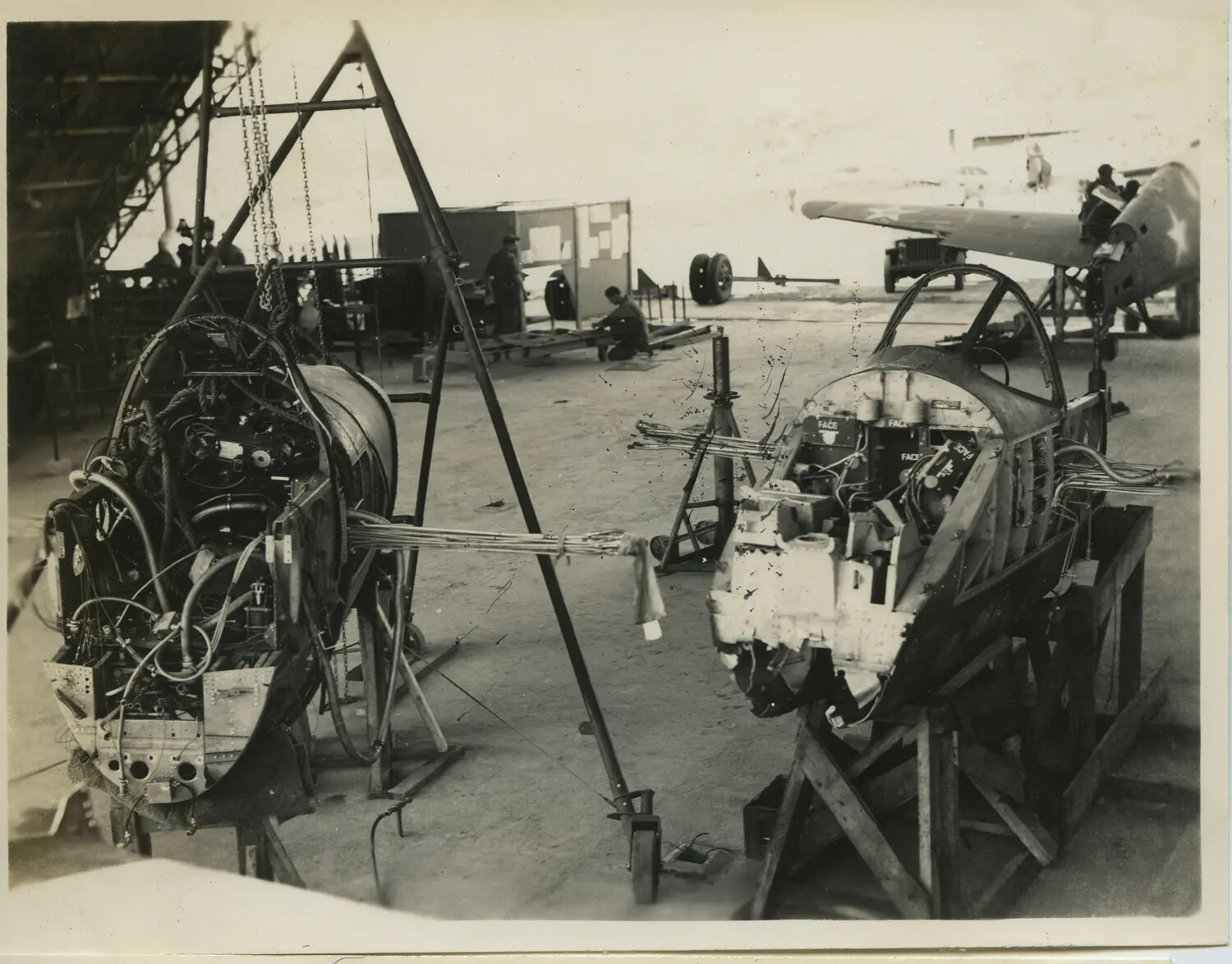 Disassembled Engine Nacelle Sections on Maintenance Stands, 312th Bomb Group Depot, WWII Pacific Theater