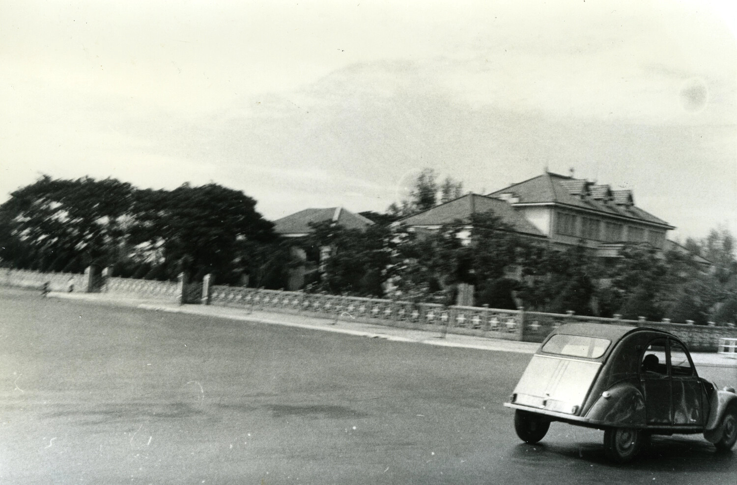 Citroen 2CV Automobile Passing Colonial Villa, Phnom Penh, Cambodia, c. 1960s
