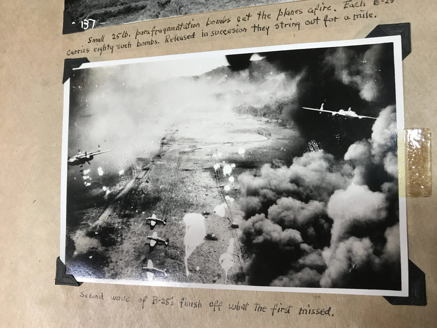 Scrapbook Page No. 137 (continued): 'Second Wave of B-25's Finish Off What the First Missed' -- Dagua Airfield Raid