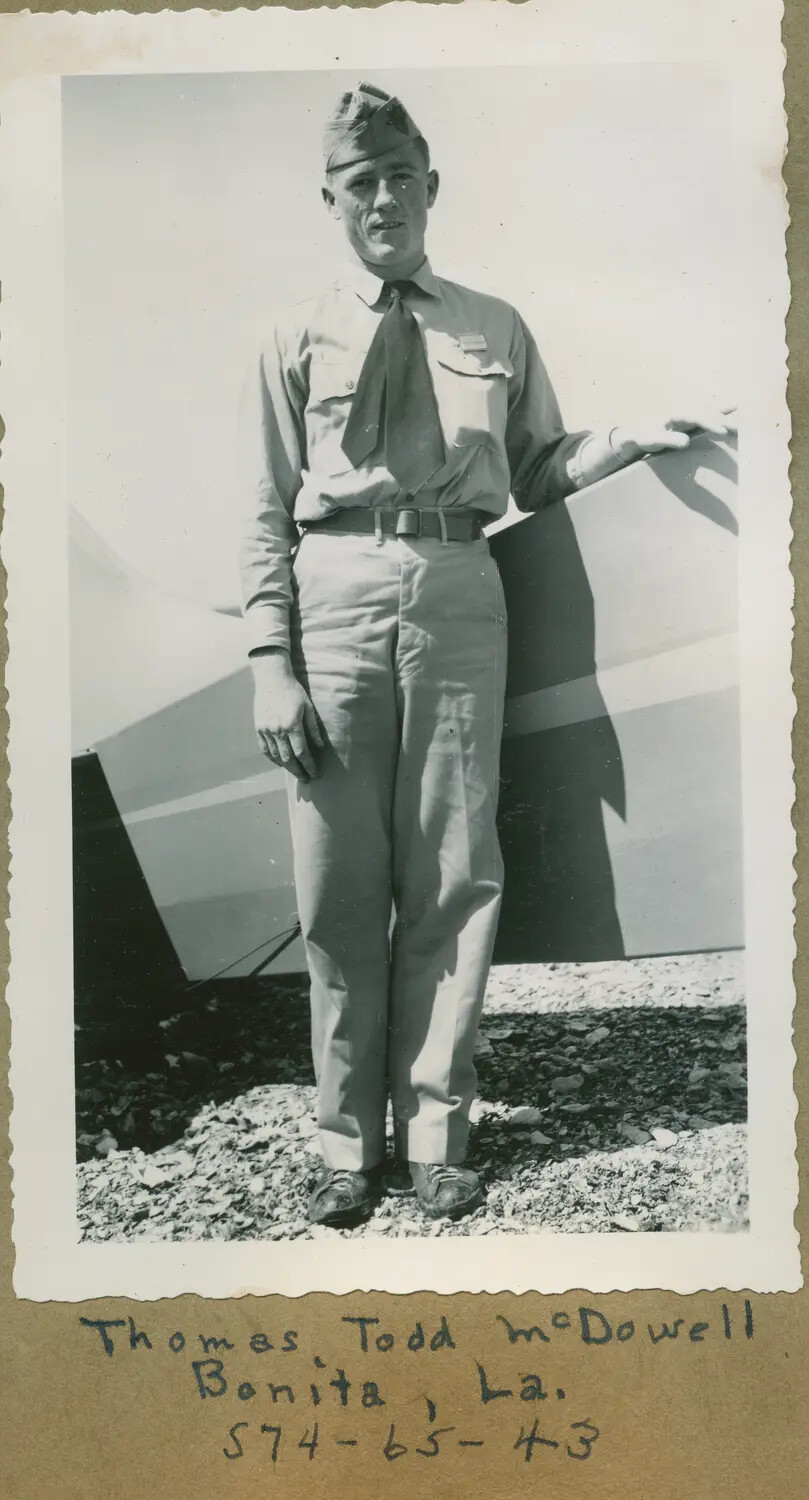 Portrait of Thomas Todd McDowell Beside Aircraft Tail Assembly