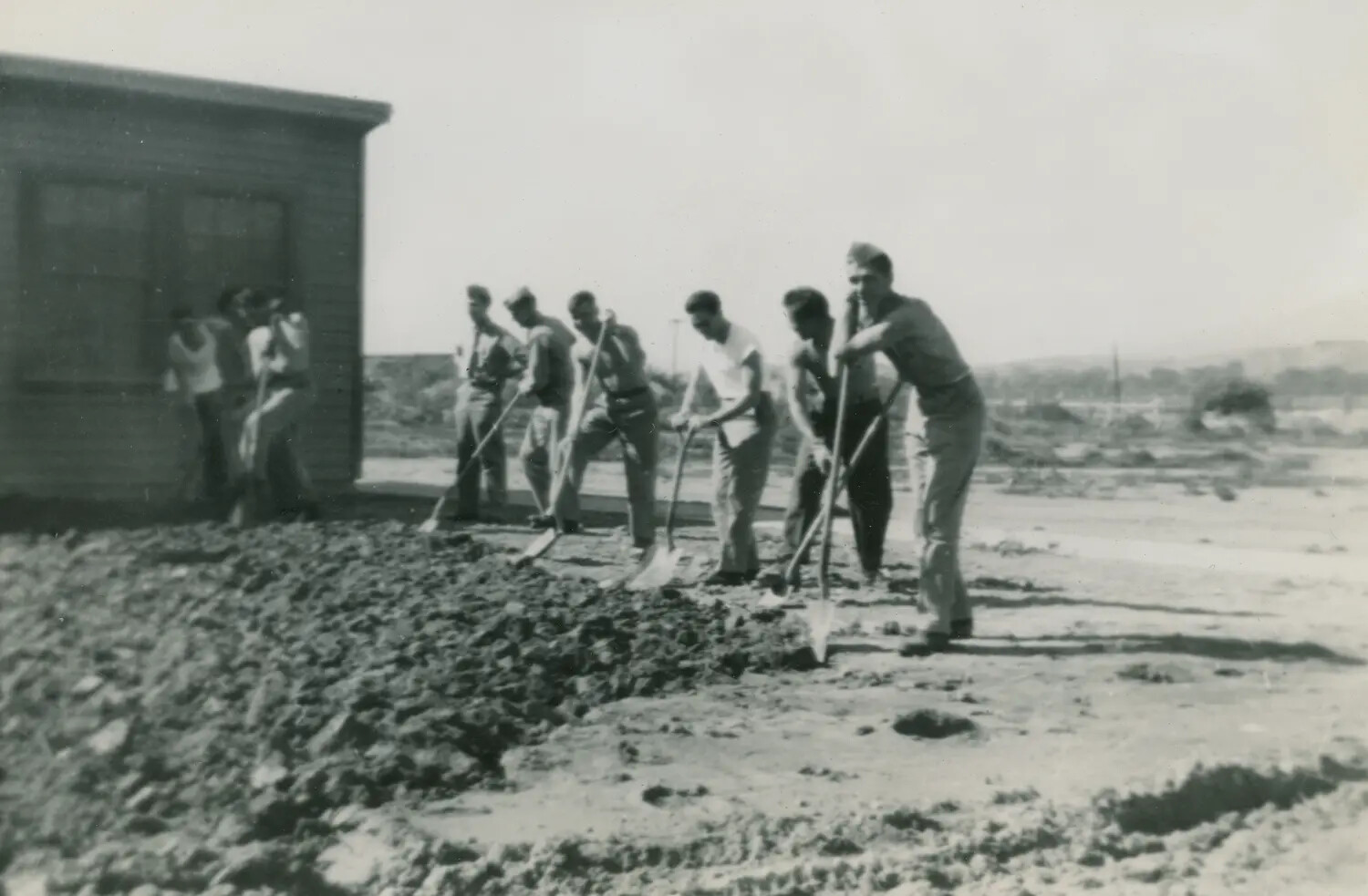 Servicemen Grading Gravel Outside Barracks Building, Edward P. McAleer WWII Photo Album