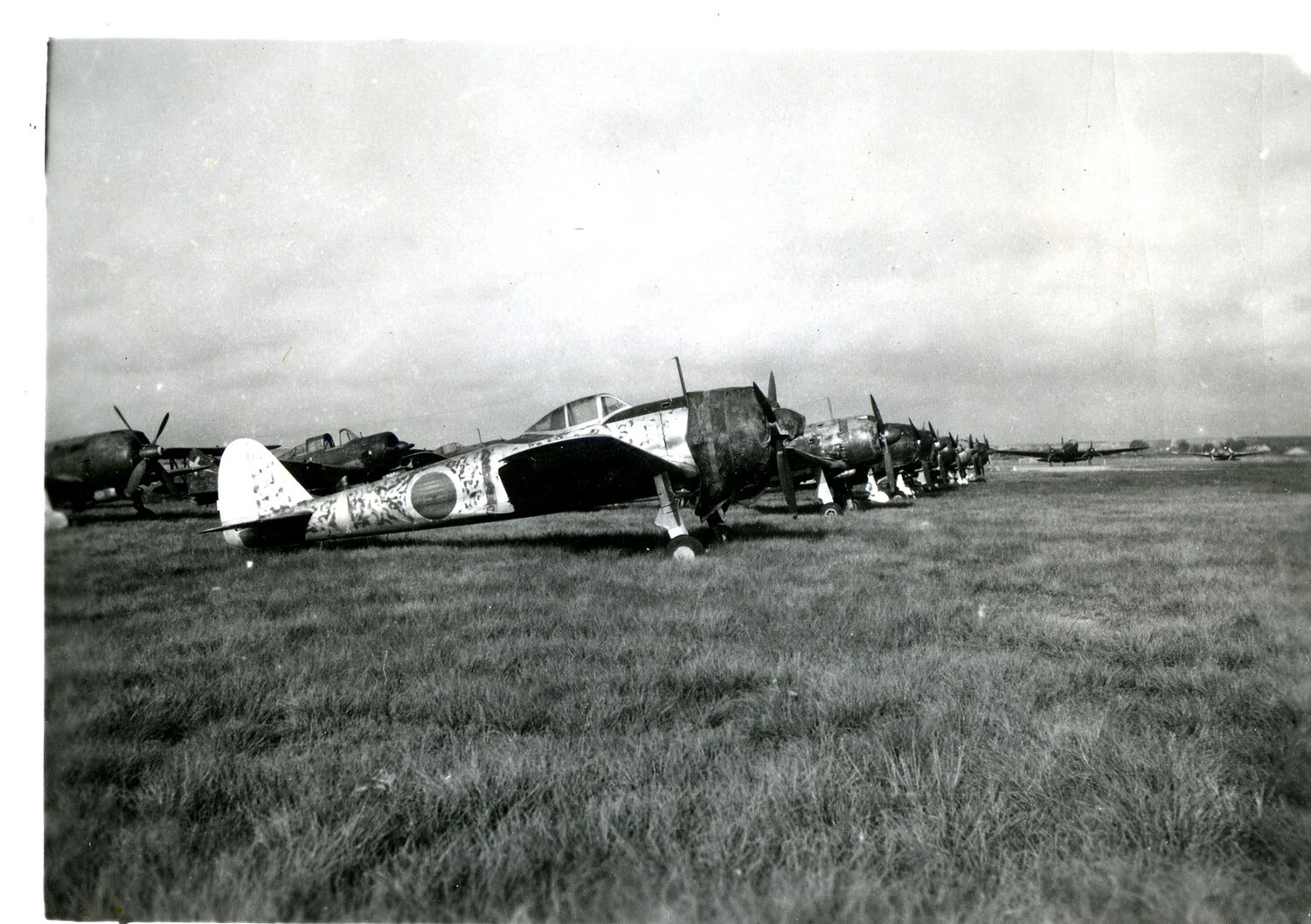 Row of Abandoned Japanese Fighter Aircraft on Captured Airfield, Burma Theater, WWII