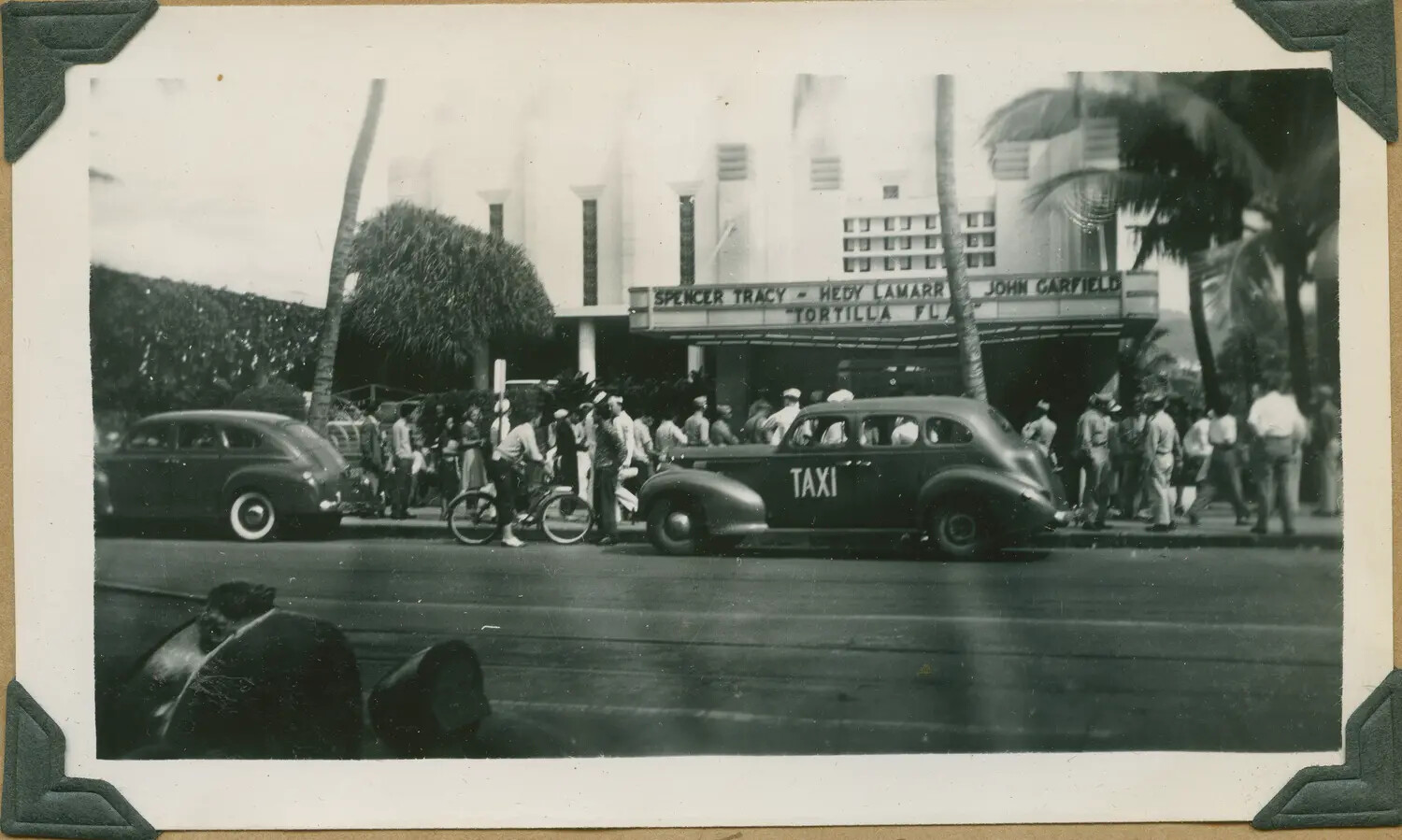 WWII Hawaii Photo Album: Waikiki Theatre Marquee for 'Tortilla Flat' (1942), Crowd and Taxi Cab
