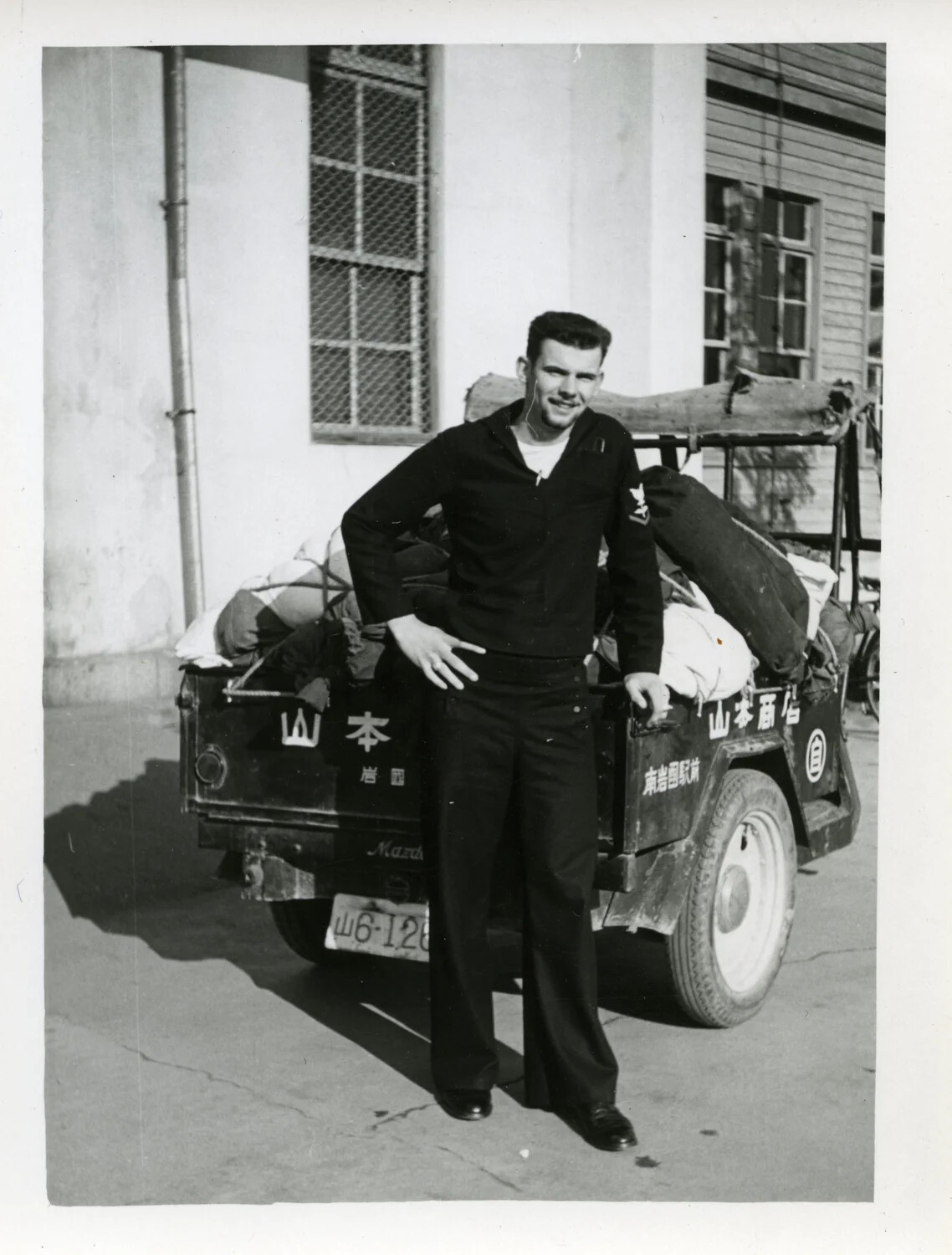 U.S. Navy Sailor Posing with Japanese Three-Wheeled Delivery Truck, Iwakuni Area, Korean War Era