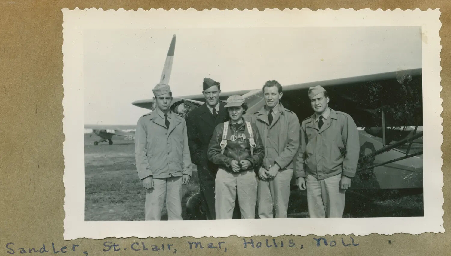 Group Portrait of Five Trainees and Instructor Beside Light Aircraft, Navy V-5 Flying Field