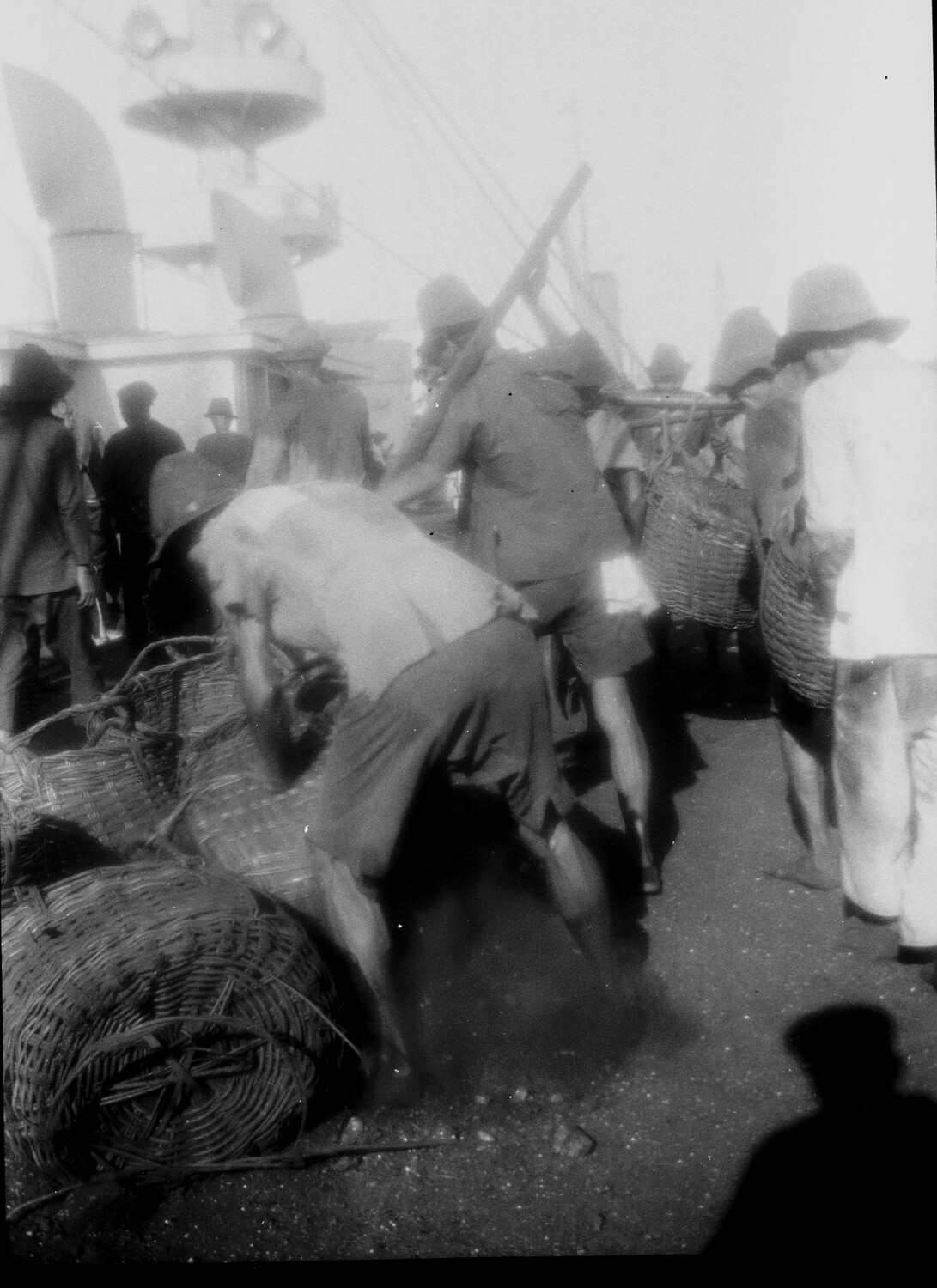 Chinese Dock Laborers Loading Cargo Baskets Aboard Ship, China, 1930s