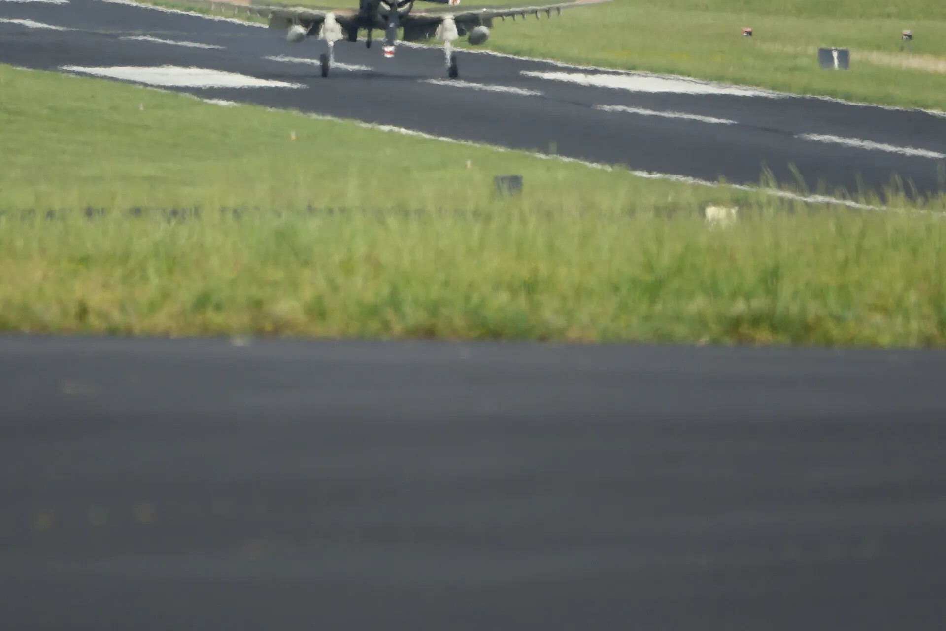 Distant, Out-of-Focus View of Taxiing Aircraft on Runway, May 2019 Airshow Event