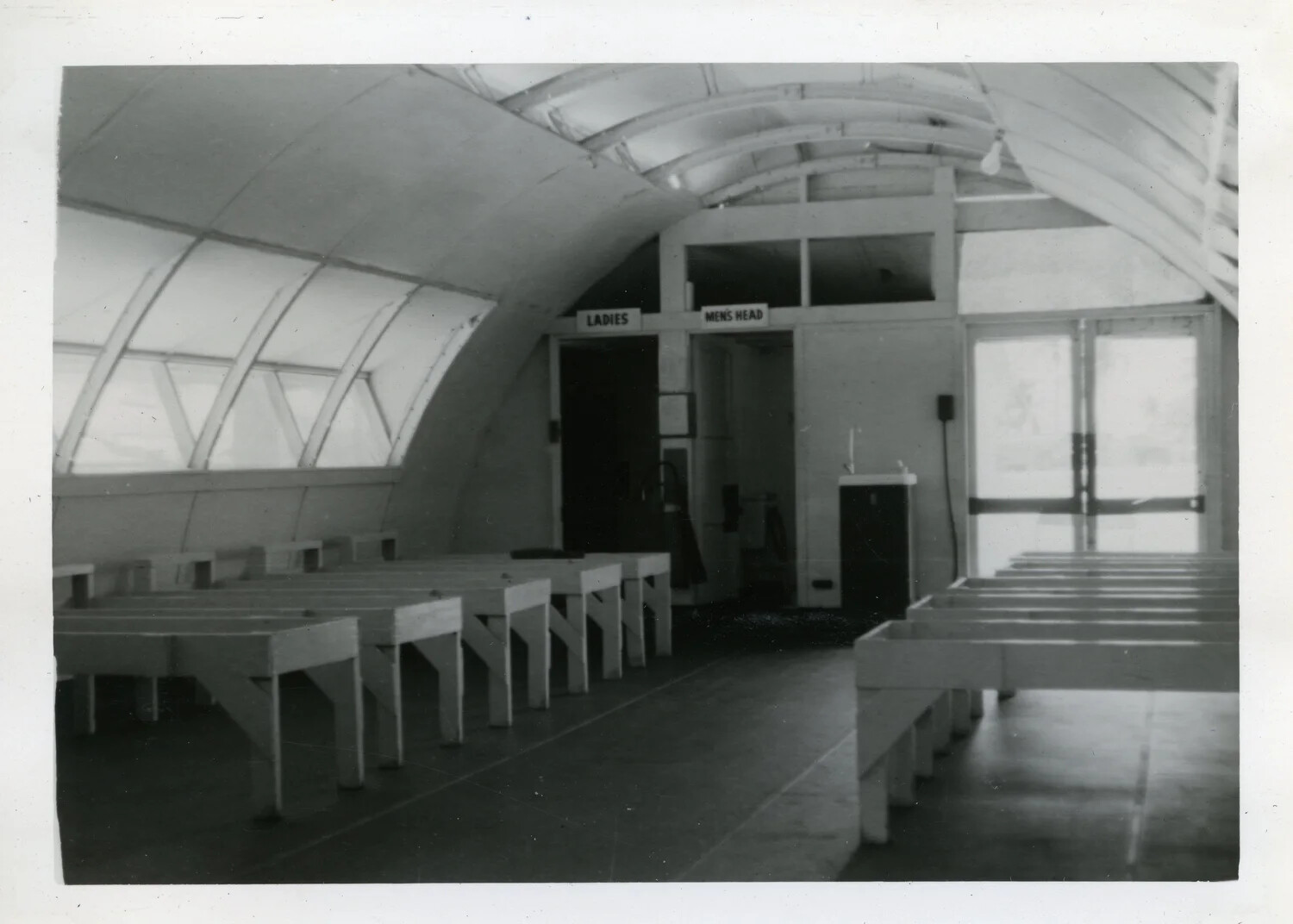 Quonset Hut Interior with Mess Tables and Restroom Signage, NAS Agana, Guam — VR-6 Squadron Album