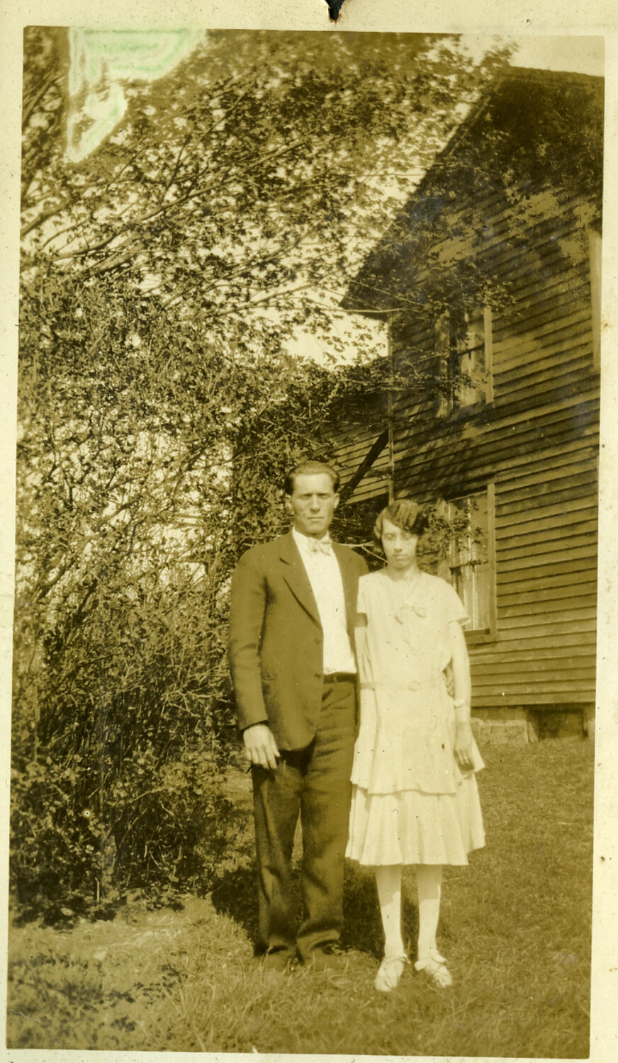 Couple Posed Before a Clapboard House, Manila Photo Album