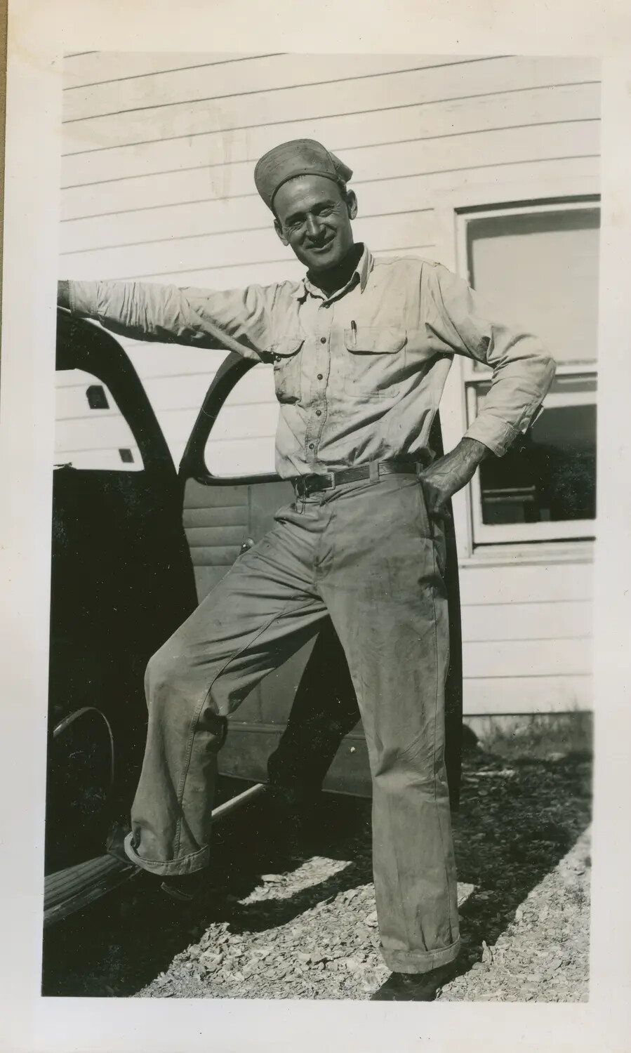 Informal Snapshot of a Young Man Posing by an Automobile
