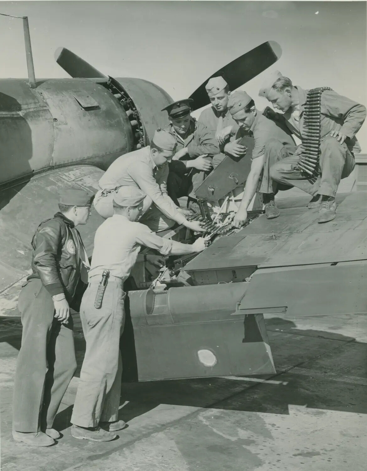Ground Crew Arming Fighter Aircraft Wing Guns, WWII USAAF Flight Line