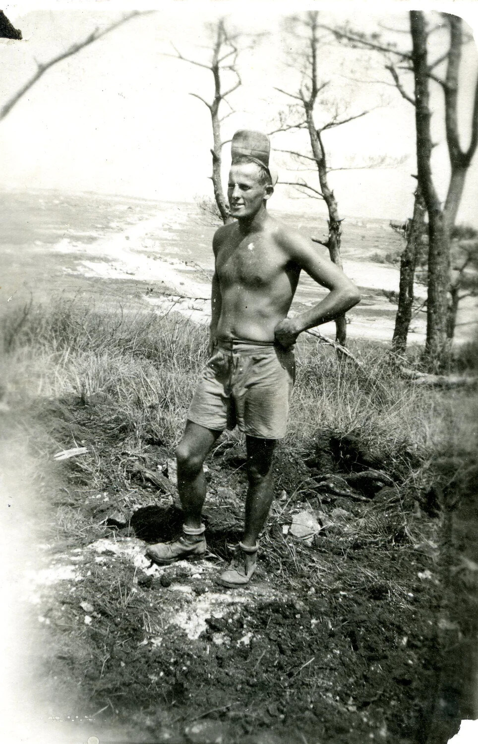 Serviceman Posing on Coastal Bluff, Ie Shima, 345th Bomber Group Photo Album, WWII