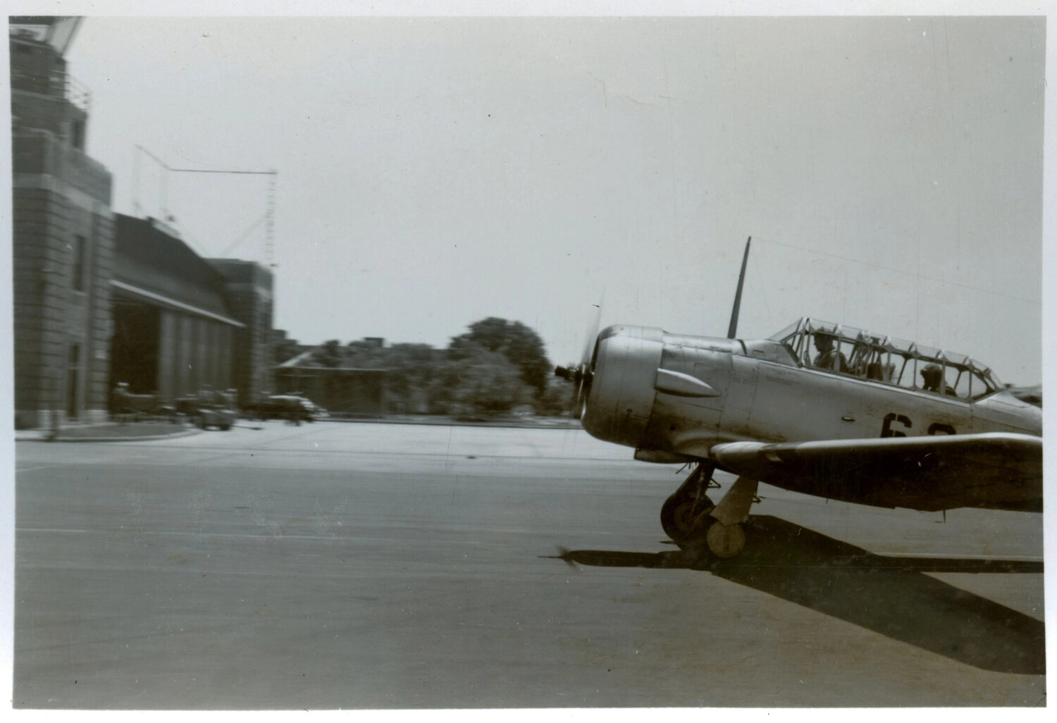 North American T-6 Texan Trainer Taxiing on Airfield Ramp