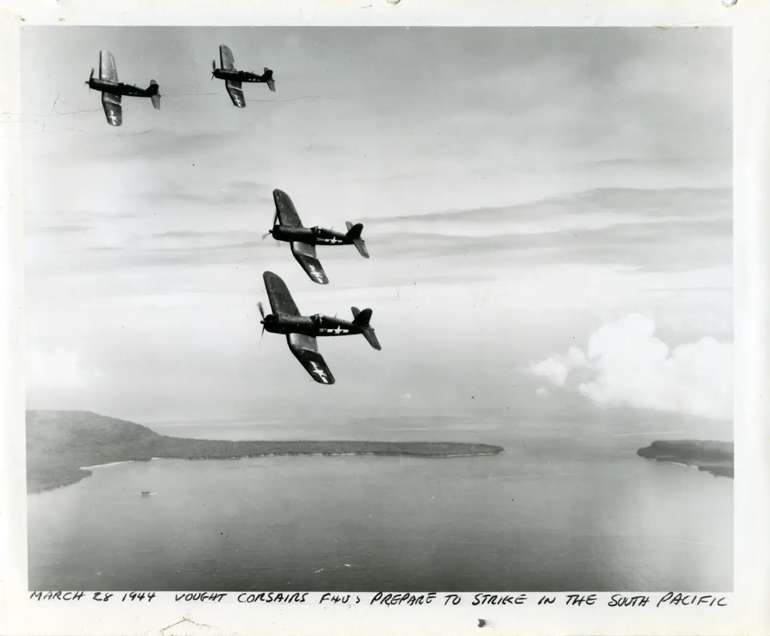 Four Vought F4U Corsairs in Formation Over South Pacific Island, March 28, 1944