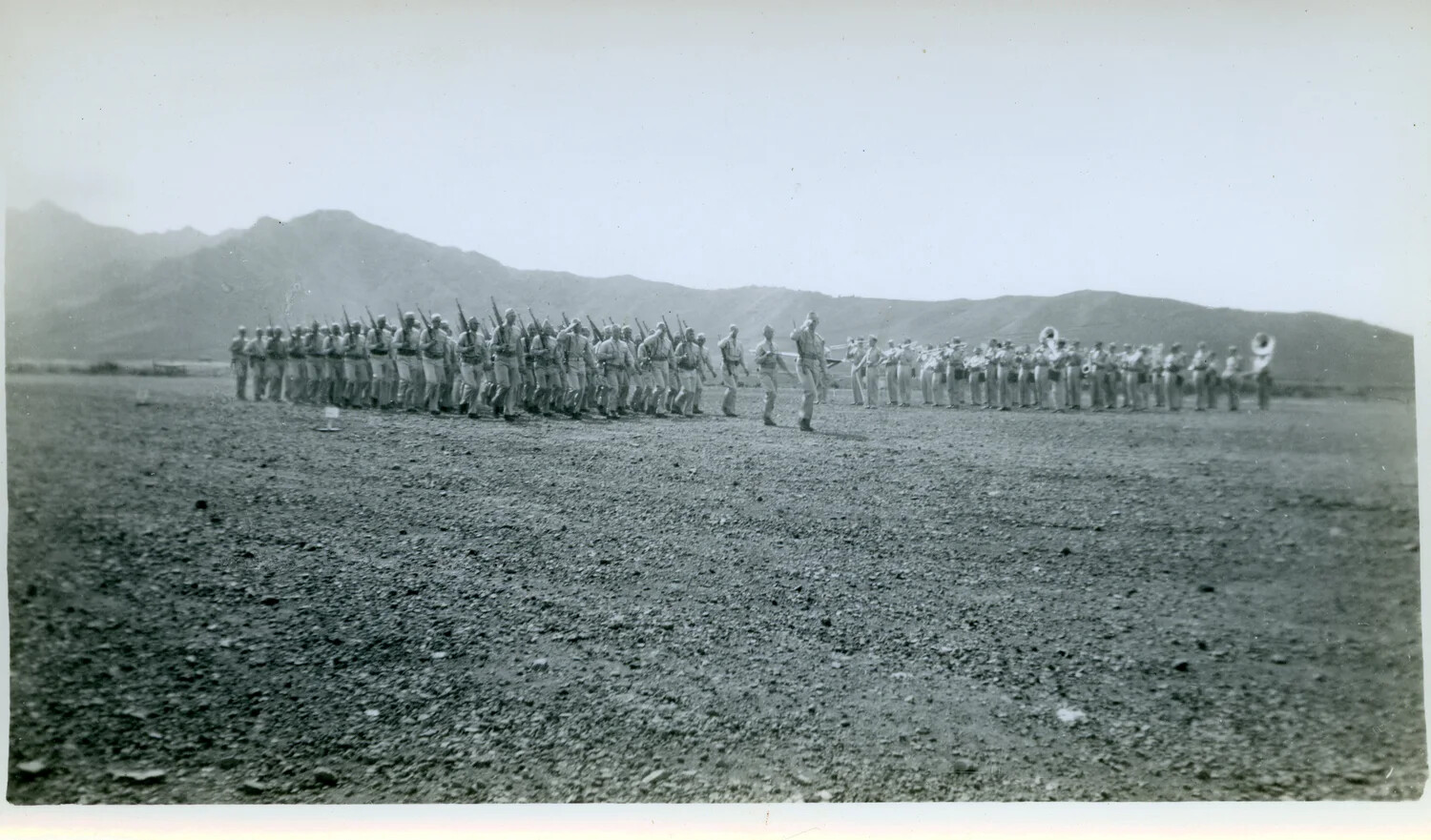 Infantry Formation Marching Past Military Band on Desert Parade Ground, WWII Era