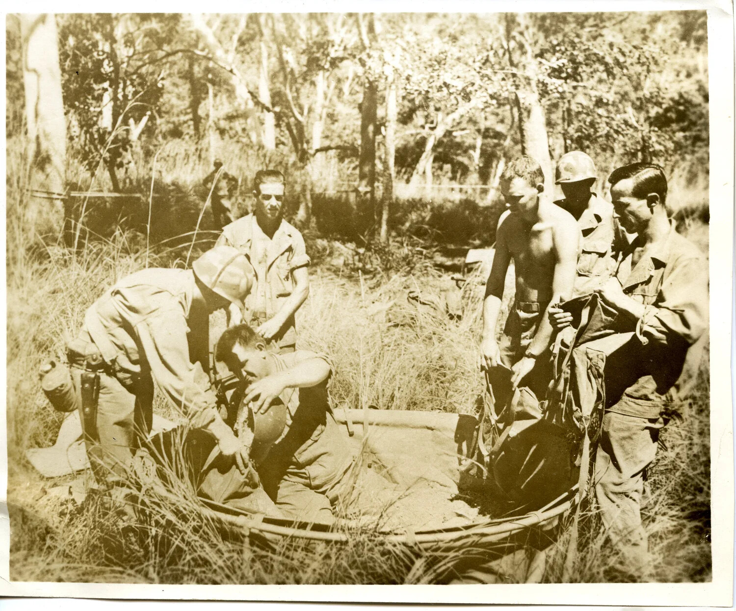 Servicemen Around Improvised Canvas Basin in Bush Camp, WWII Pacific Theater