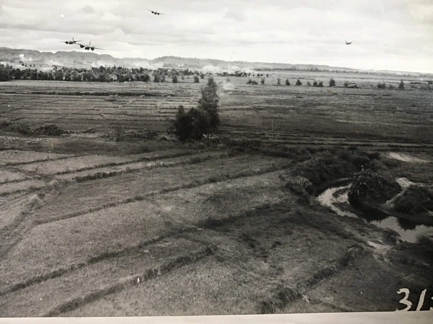 B-25 Mitchells Flying Low Over Rice Paddy Terrain During Attack Mission
