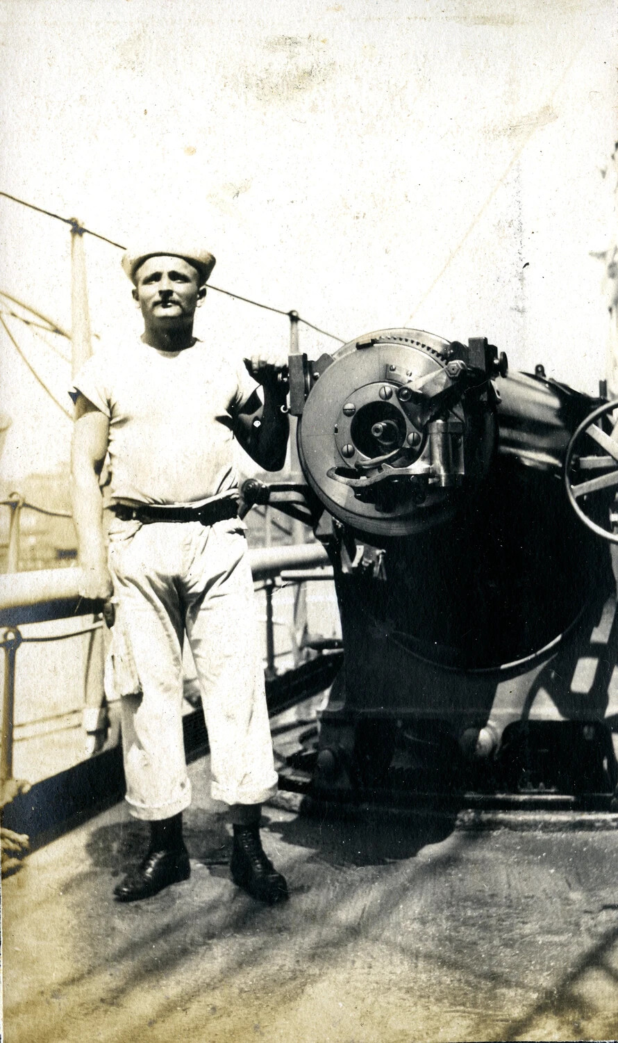 Sailor Posed with Deck Gun Breech Mechanism, U.S. Navy Cruiser, Early 1900s