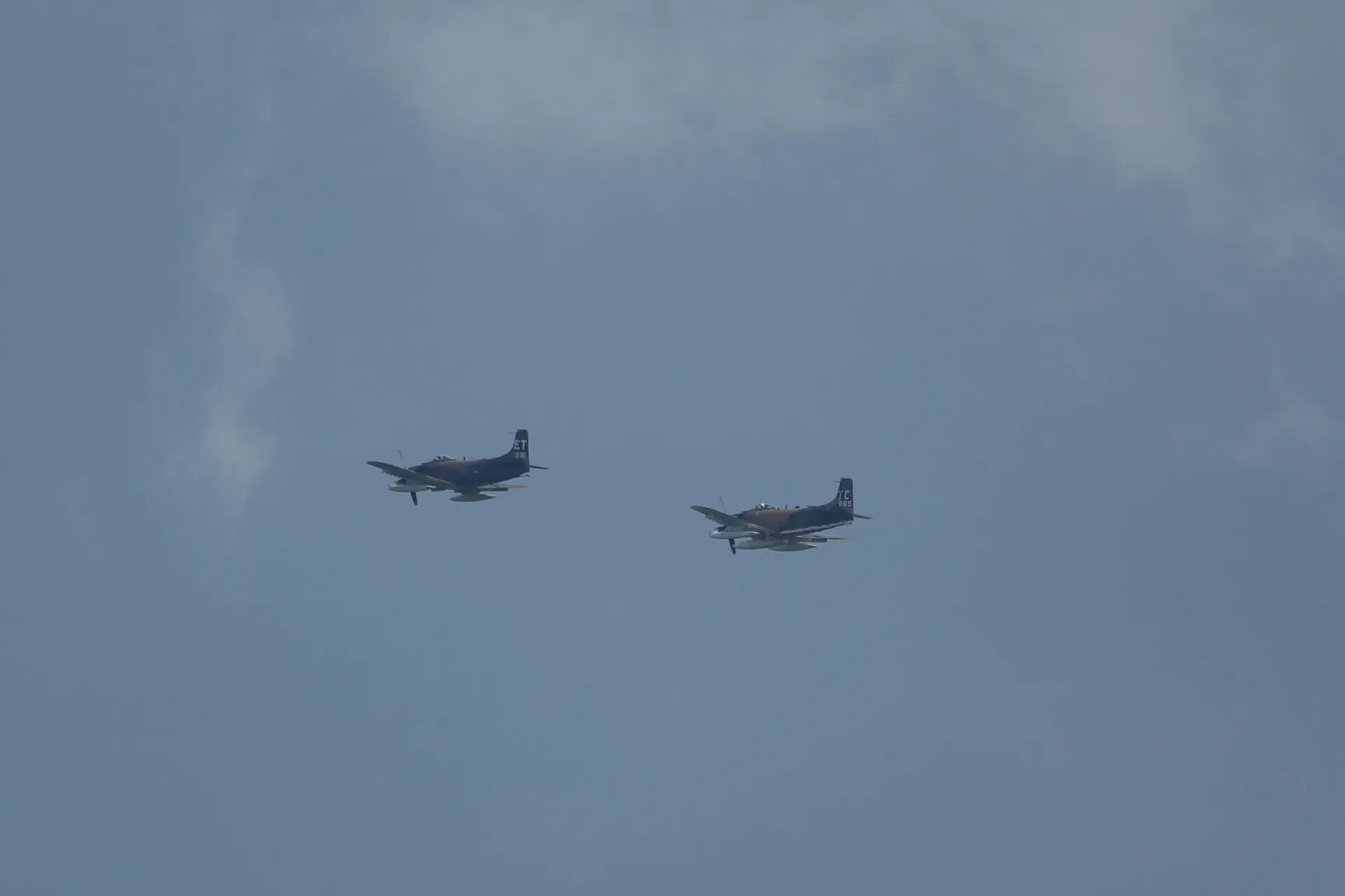 Formation Flight of Two Douglas A-1 Skyraiders, Tail Codes 'ET' and 'TC 665', May 2019 Fly-In