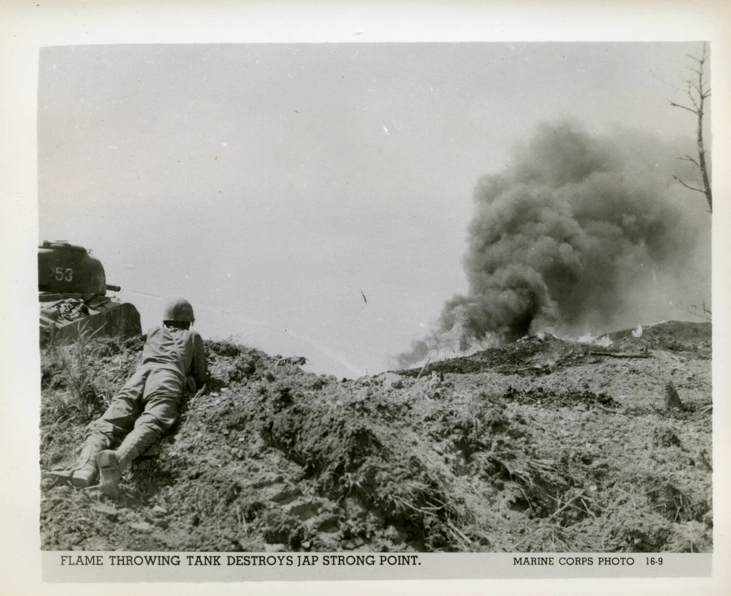 "Flame Throwing Tank Destroys Jap Strong Point" -- Official U.S. Marine Corps Combat Photograph, Battle of Okinawa, 1945
