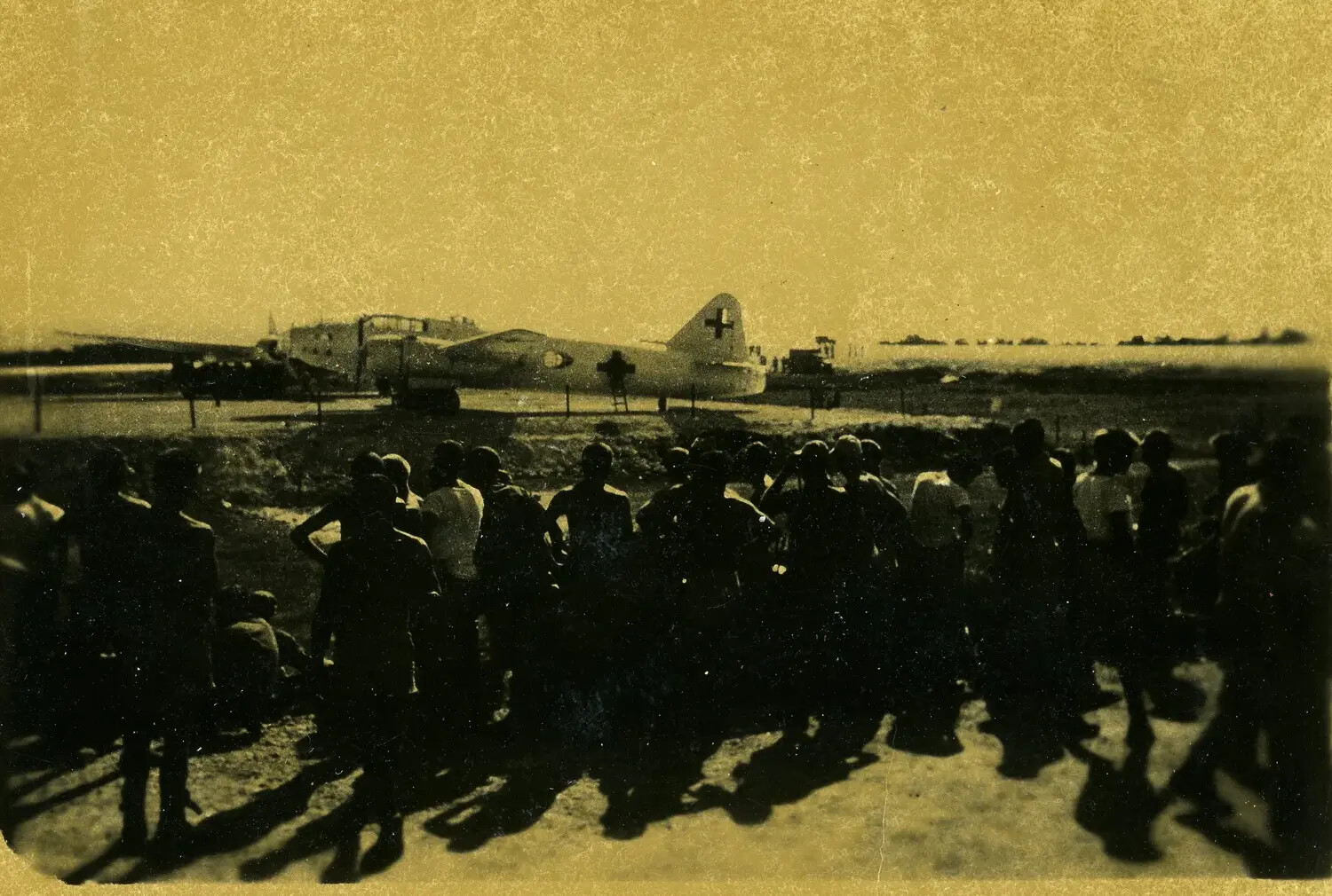 Japanese 'Betty' Bomber with White Surrender Markings Surrounded by American Servicemen, Ie Shima Envoy Flight, August 19, 1945