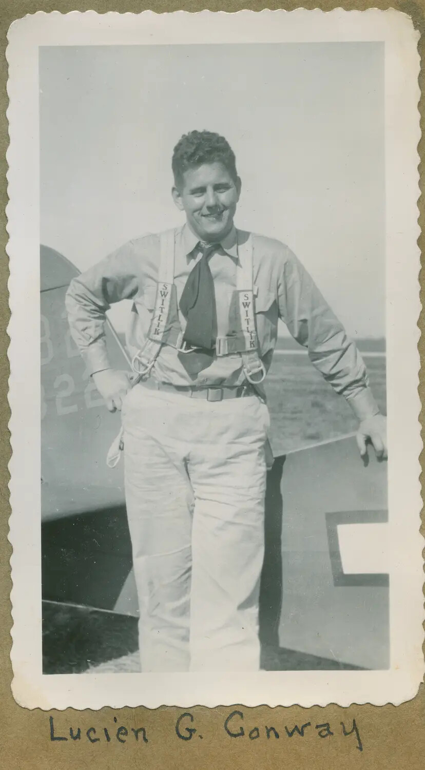 Lucien G. Conway Wearing Switlik Parachute Harness Beside Training Aircraft