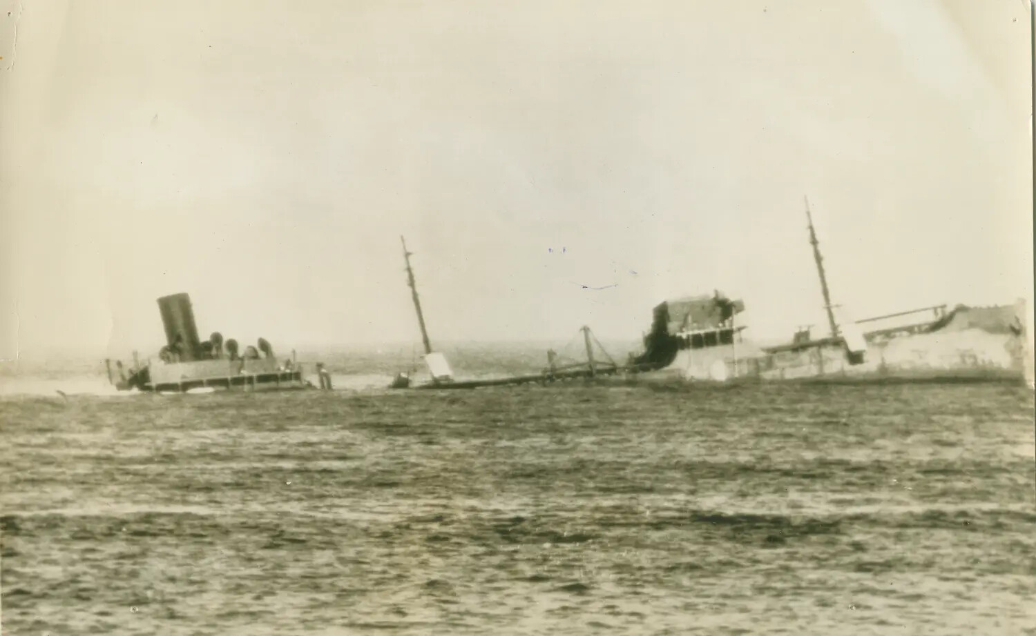 Sinking Merchant Ship, Broken in Two - WWII Press Photograph