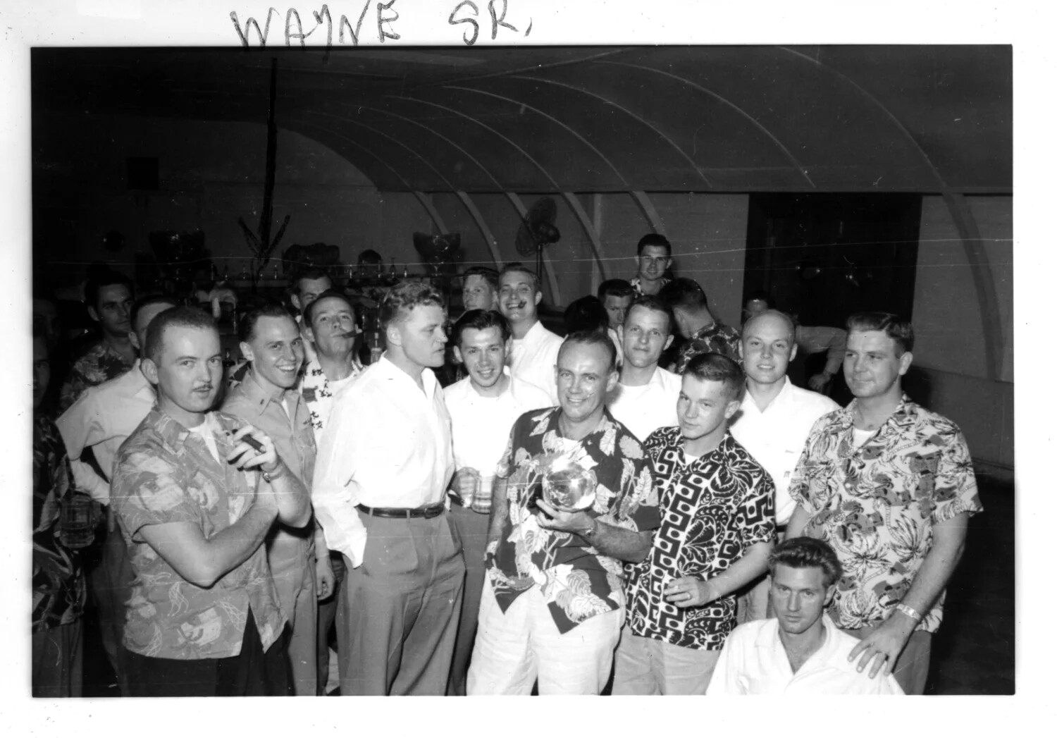 Servicemen Celebrating with Trophy in Recreation Hall