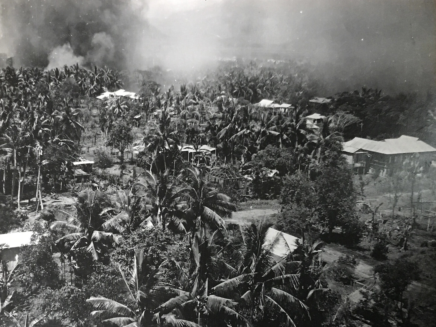 Strike Photograph of Palm-Shaded Village, La Torre, Philippines, 387th Bomb Squadron, 312th Bomb Group, 5 May 1945