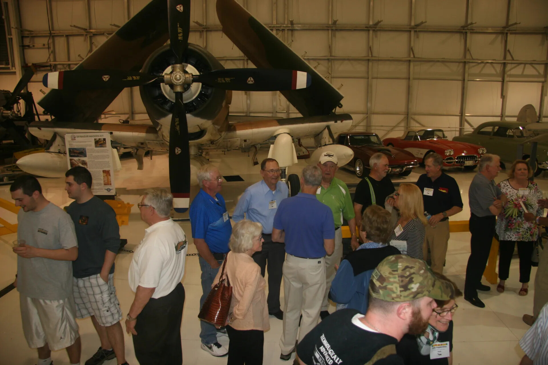Attendees Gather Beneath Restored A-1 Skyraider, Operation Tailwind Reunion Event, April 2016